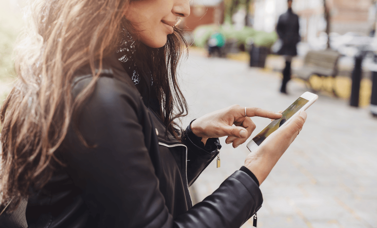 Woman Discovering Ads on Smartphone